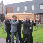Nephews carry Fr Tom to cemetery